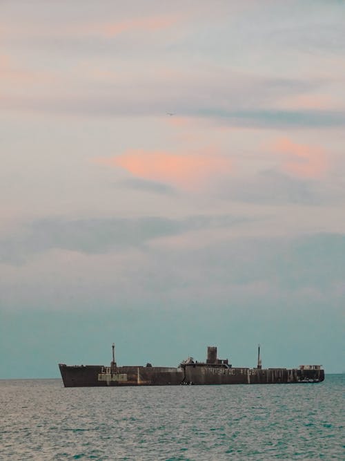 Free An  Abandoned Shipwreck on Sea Stock Photo