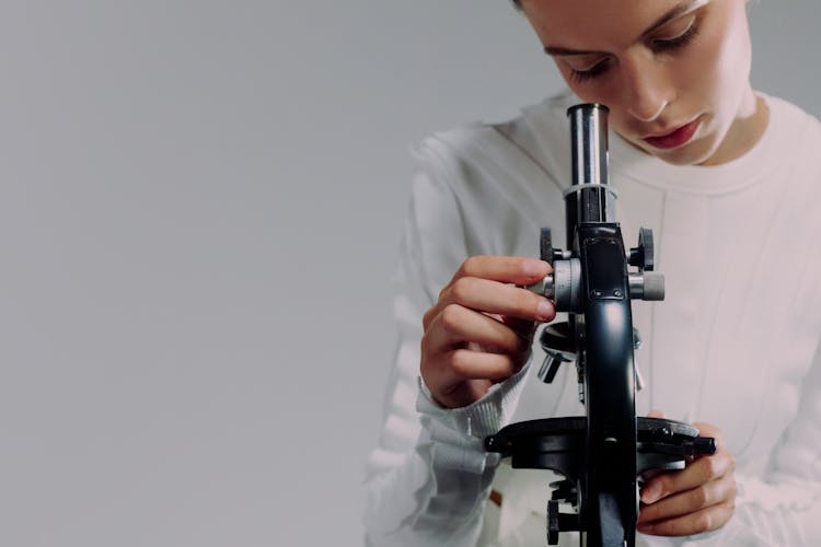 Woman Using Microscope