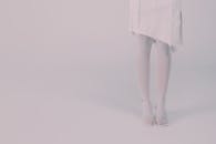 Close up view of legs in white tights