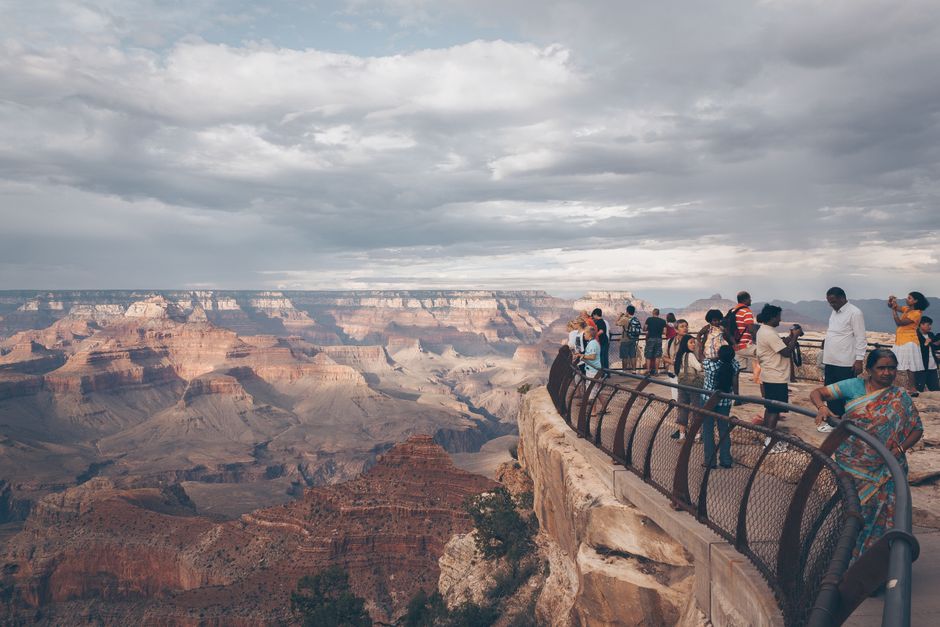family enjoying the grand canyon at sunset - affordable family adventure vacations family enjoying the grand canyon at sunset - affordable family adventure vacations