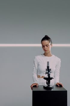 Minimalist portrait of a female scientist with a microscope, emphasizing modern science.