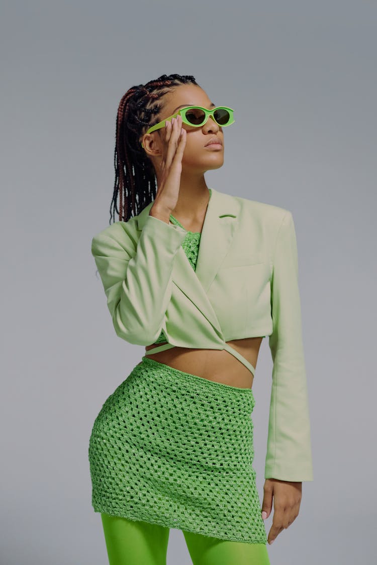 Studio Portrait Of Woman In Green Clothing