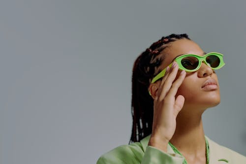 Free Woman in green sunglasses looking up Stock Photo