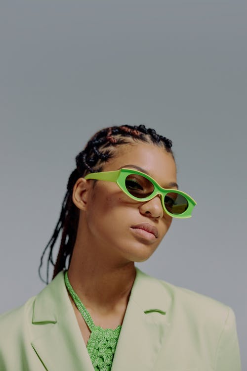 Portrait of woman in green sunglasses · Free Stock Photo