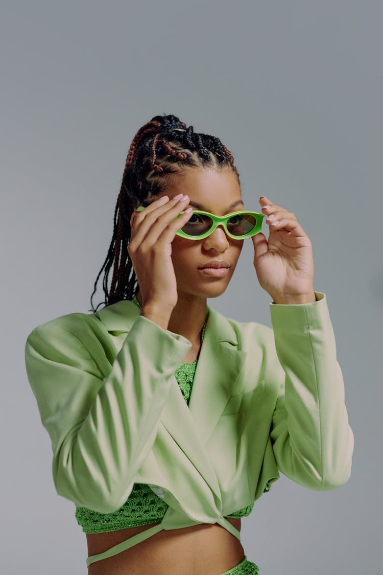 Waist Up Portrait Of Woman In Green Clothes