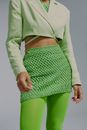 Midsection of woman in green clothing