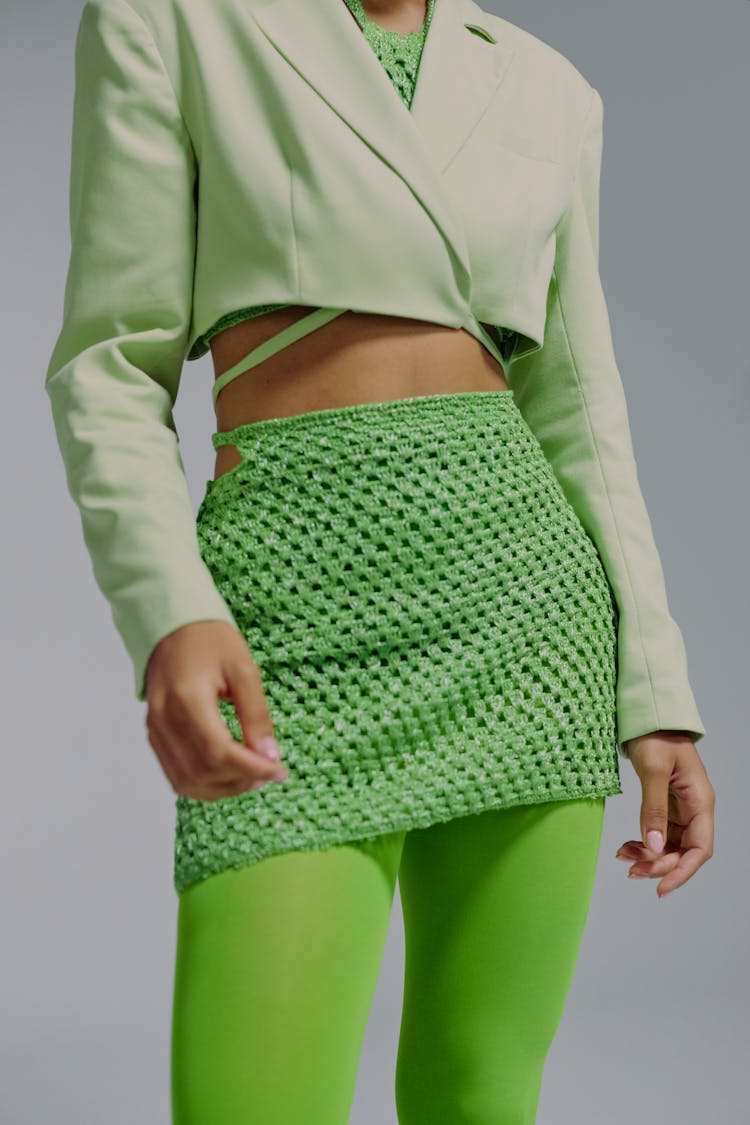 Midsection Of Woman In Green Clothing