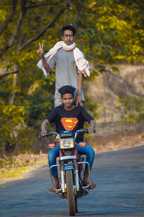 Two Men Riding a Standard Motorcycle