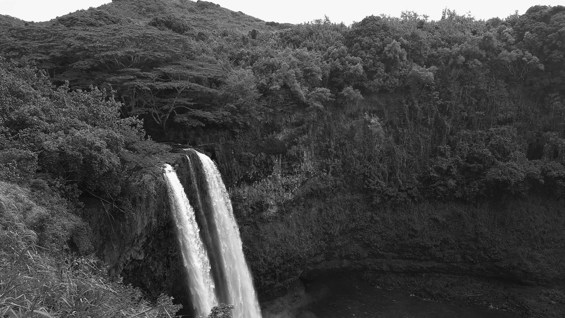Wailua Falls, a twin waterfall in tropical greenery near Lihue, Kauai