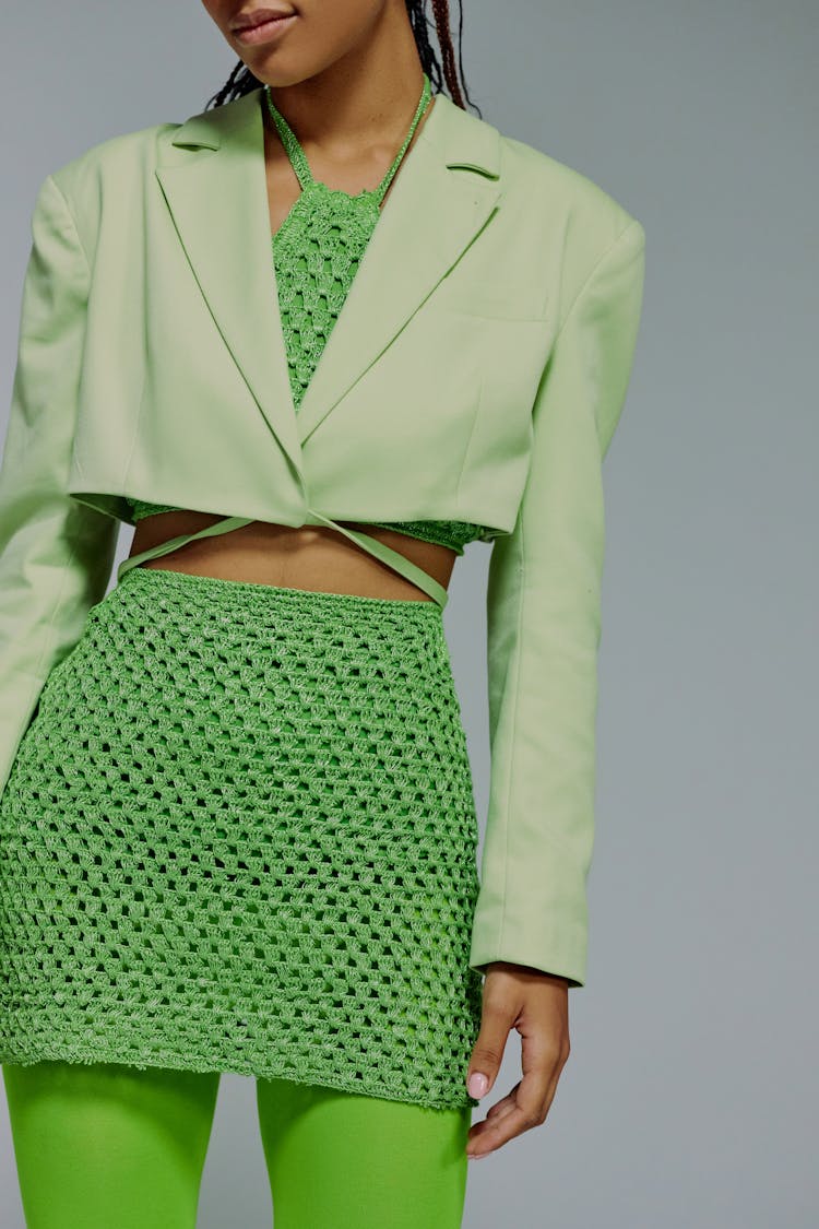 Midsection Of Woman In Green Jacket And Skirt