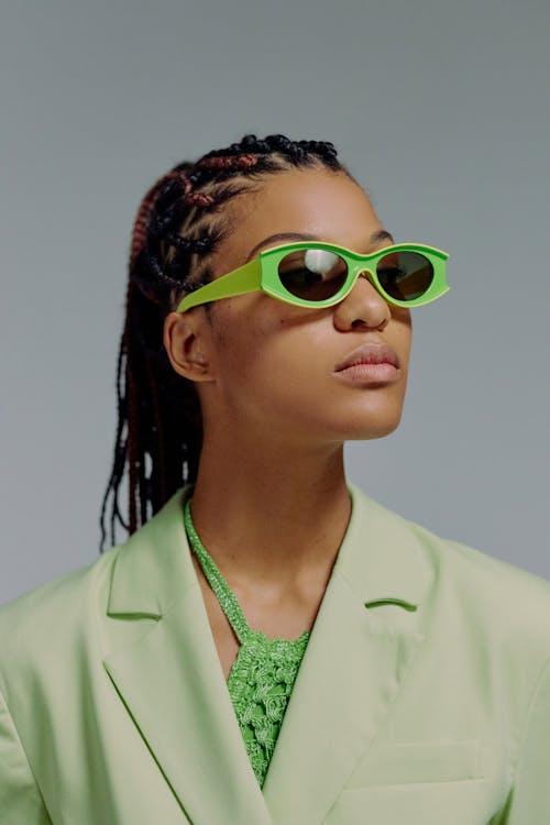 Portrait of woman in green sunglasses