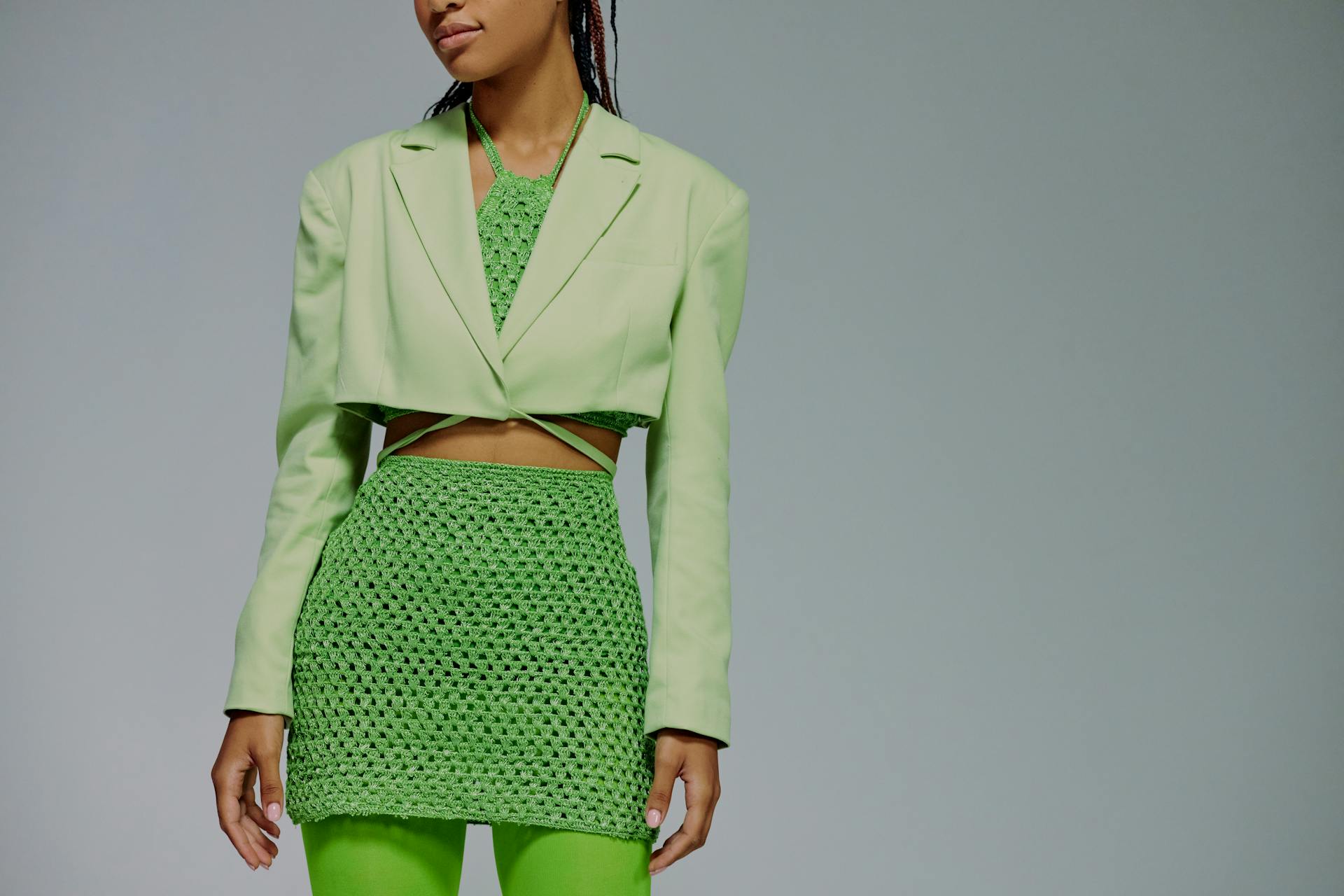 Midsection of woman in green clothing