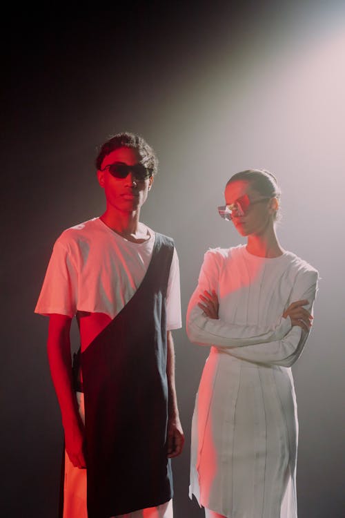 A Man and a Woman in White Wearing Sunglasses
