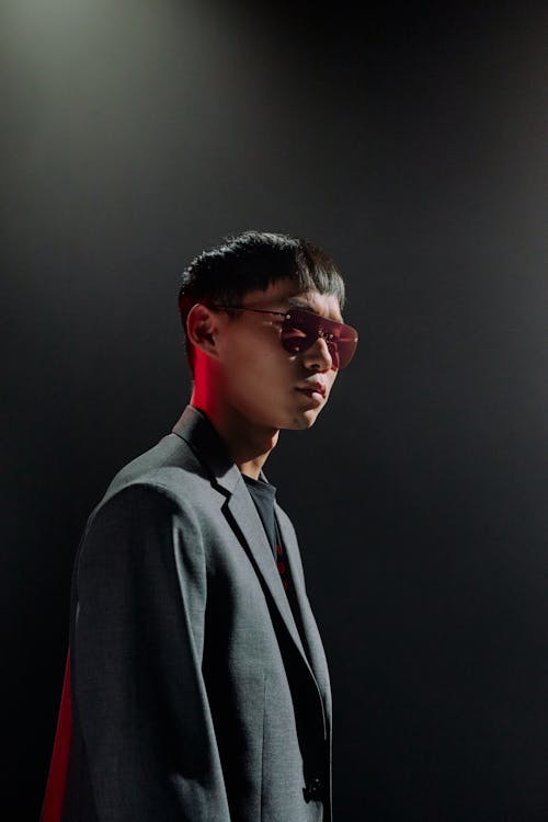 Studio shot of man in suit and sunglasses