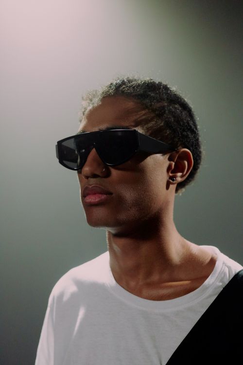 Free Close-up of stylish man wearing sunglasses, showcasing modern fashion trends. Stock Photo