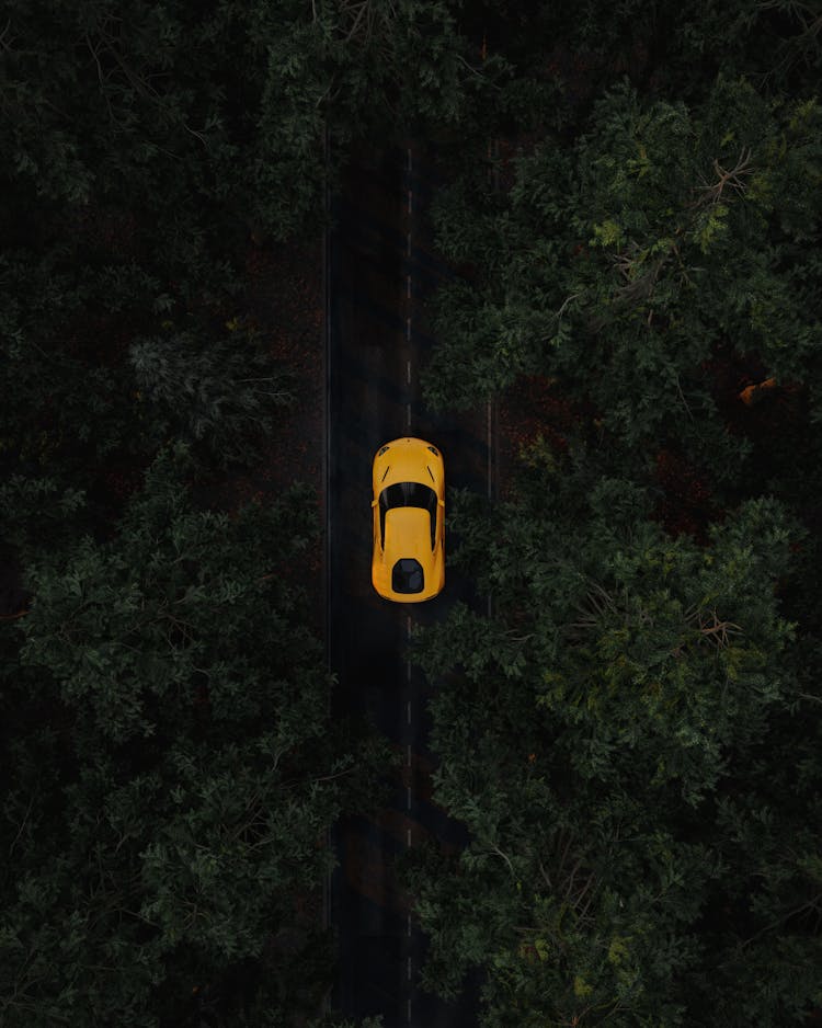 Yellow Sportscar Driving On Middle Of The Road