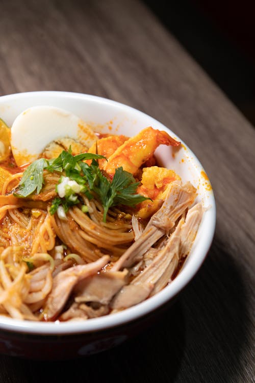A Delicious Curry Laksa in White Bowl