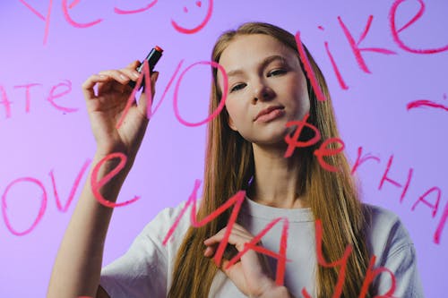 Girl behind words on glass