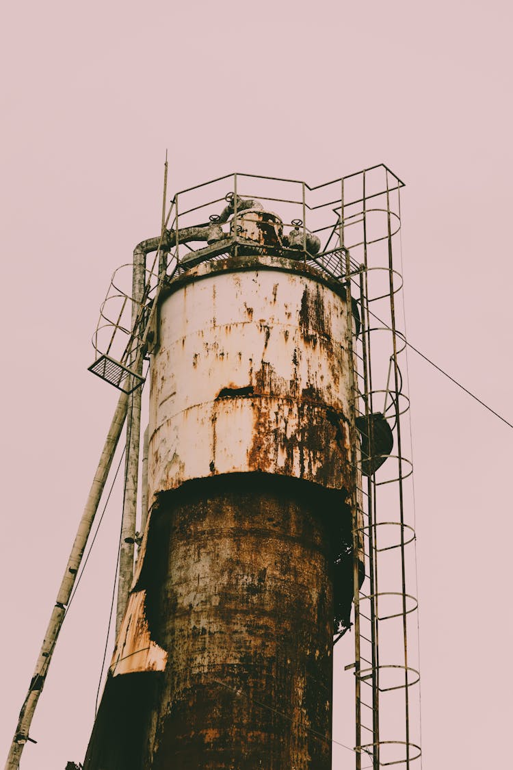 Rusted Industrial Structure Against Pastel Pink Sky