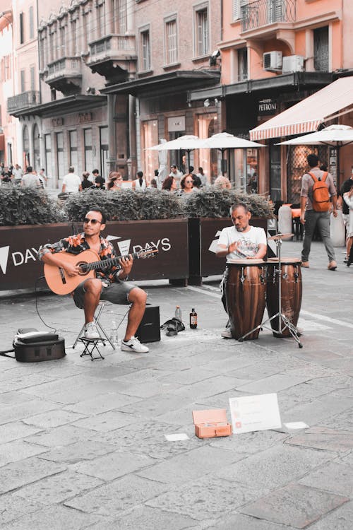 Men Playing Musical Instruments on the Street