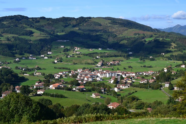 Aerial Photography Of Village On The Foot Of The Mountain