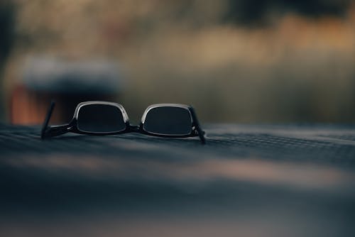 Sunglasses on Black Surface