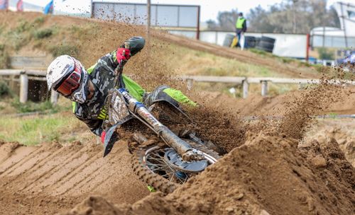 Free Exciting motocross rider kicking up dirt on a race track in Cape Town, South Africa. Stock Photo