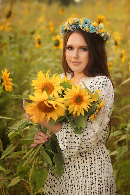 Woman Holding Sunflowers