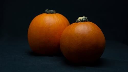 Free Orange Fruit on Black Surface Stock Photo