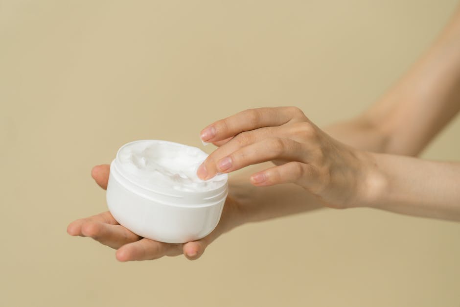 Woman applying lightweight moisturizer to oily skin