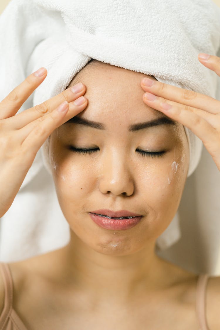 Close Up View Of Woman With Hair Wrapped In Towel