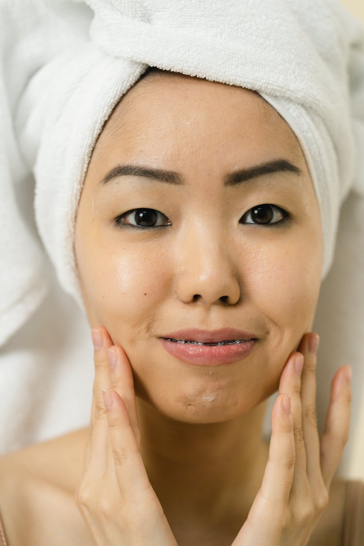 Woman With Her Hair Wrapped In Towel