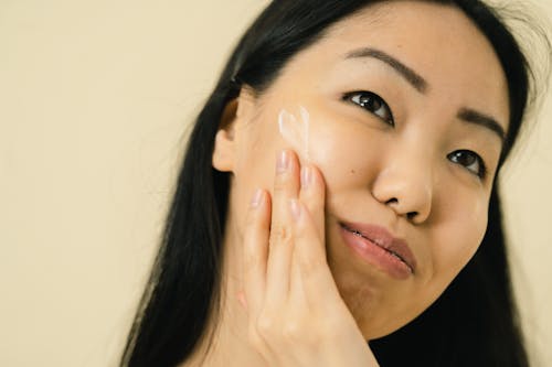 Free Woman with cream on her cheek Stock Photo