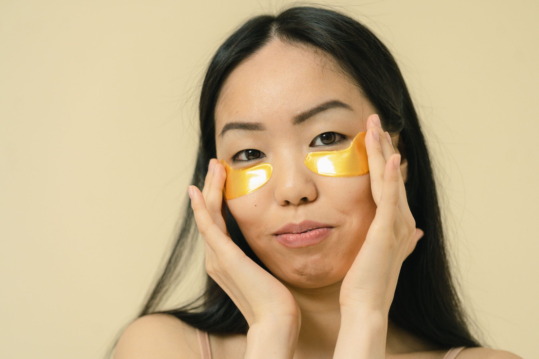 Happy Korean woman with perfectly clear, radiant skin after successful skin whitening treatment