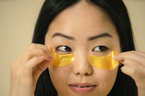 Close up view of woman holding masks