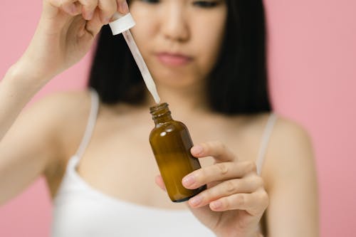 Close up view of woman using beauty product