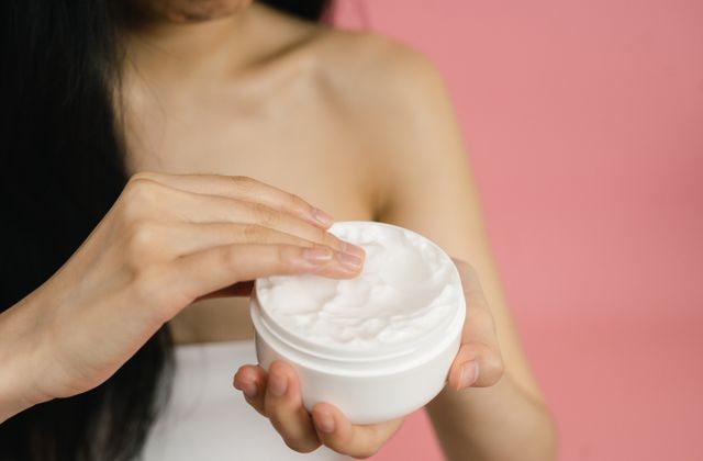 Woman applying cream