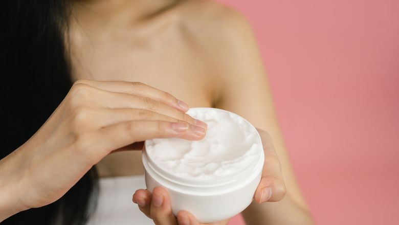 Woman applying cream