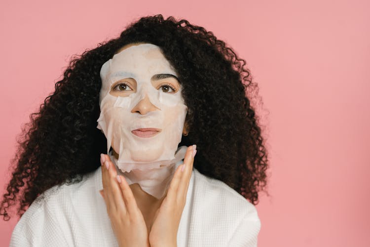 White Foil Wrapping Masks Covering Face And Neck Of Woman