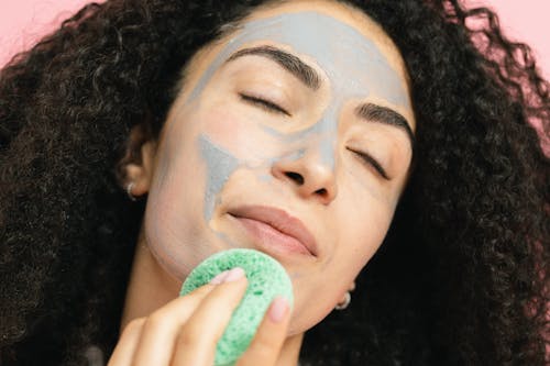 Woman removing the face mask