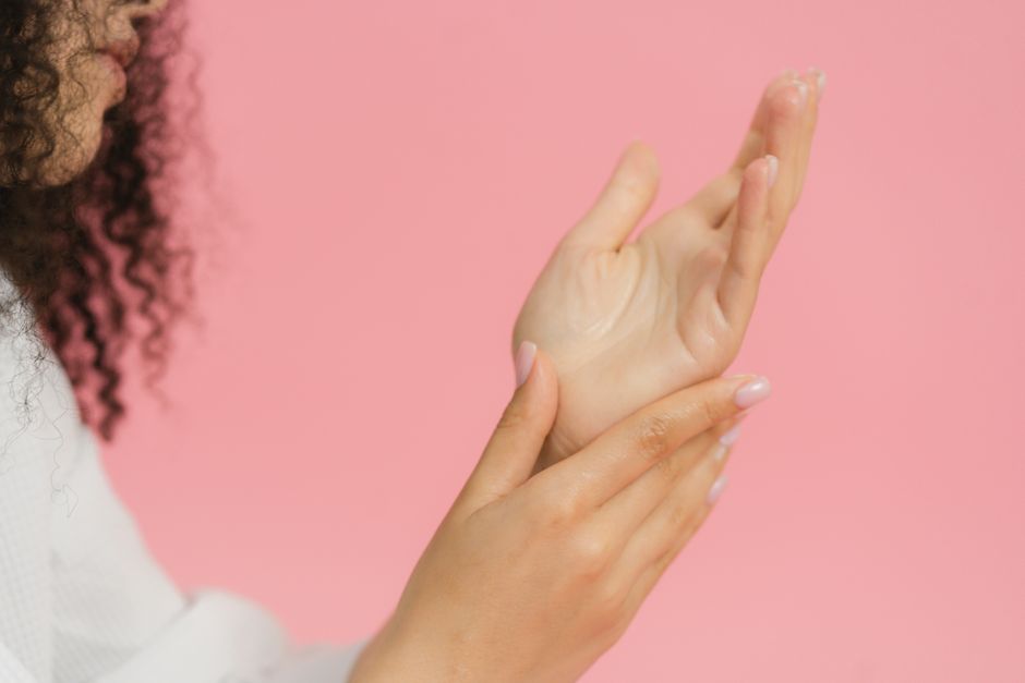 woman hands showing sweat palms moisture close-up