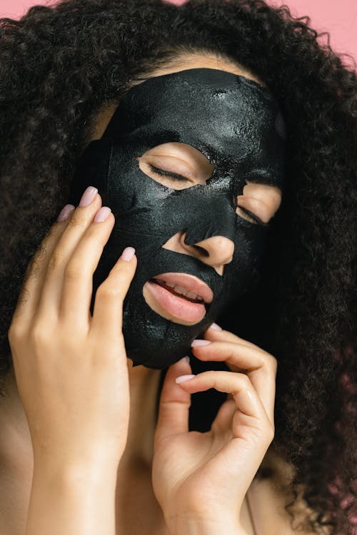 Close Up Photo of Woman with Cosmetic Mask