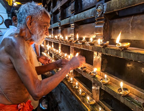 Free Man Lighting Candles Stock Photo