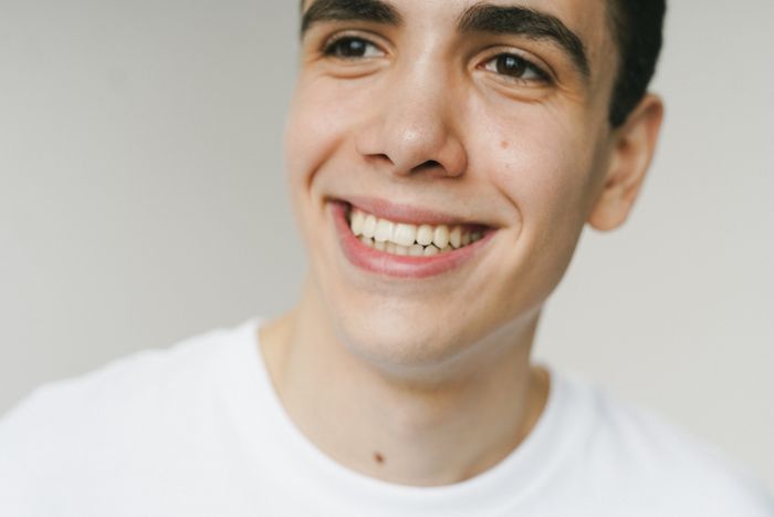 Patient with a radiant smile following cosmetic dental work