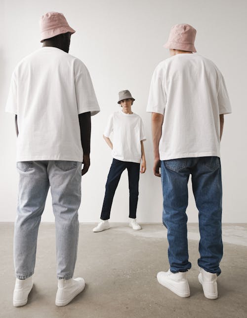 Free A Group of People Wearing White Shirt and Bucket Hats Stock Photo