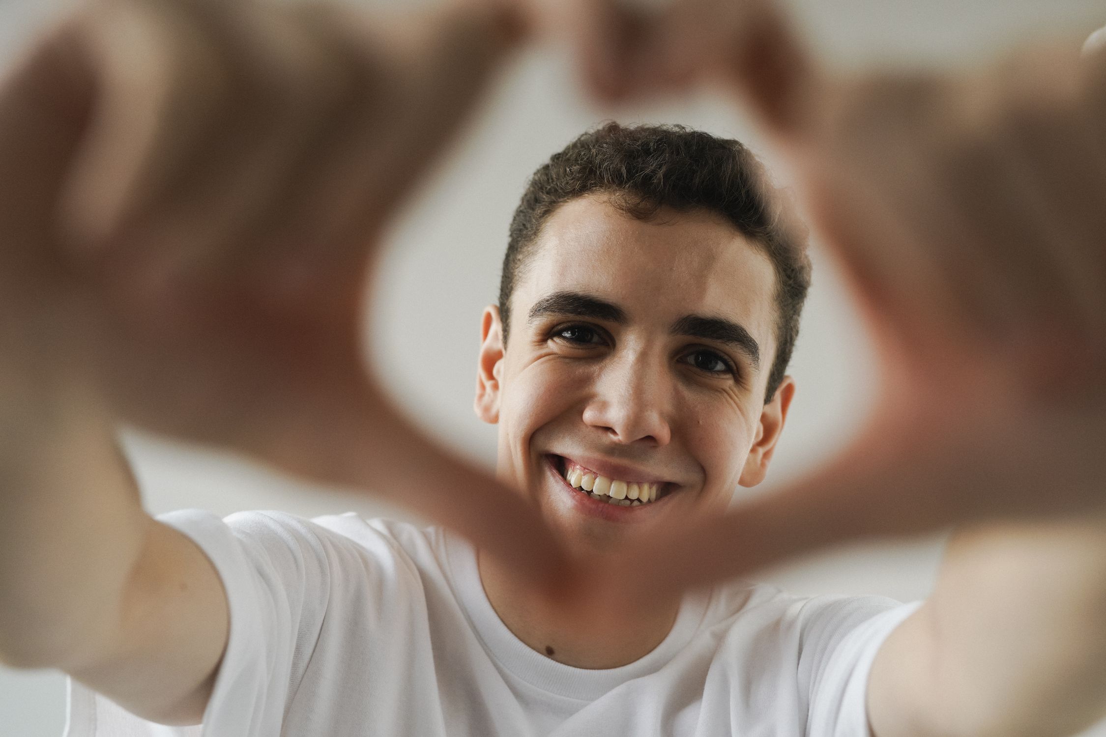 Young Man Smiling and Making a Heart Shape with His Hands · Free Stock ...