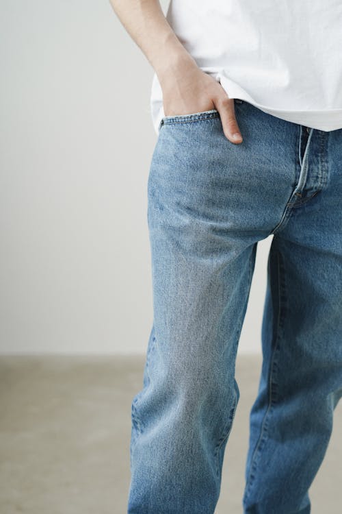 Free A Person Wearing Denim Jeans with It's Hand on Pocket Stock Photo