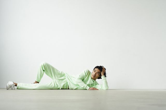 Model reclining in a mint tracksuit — photo by SHVETS production on Pexels