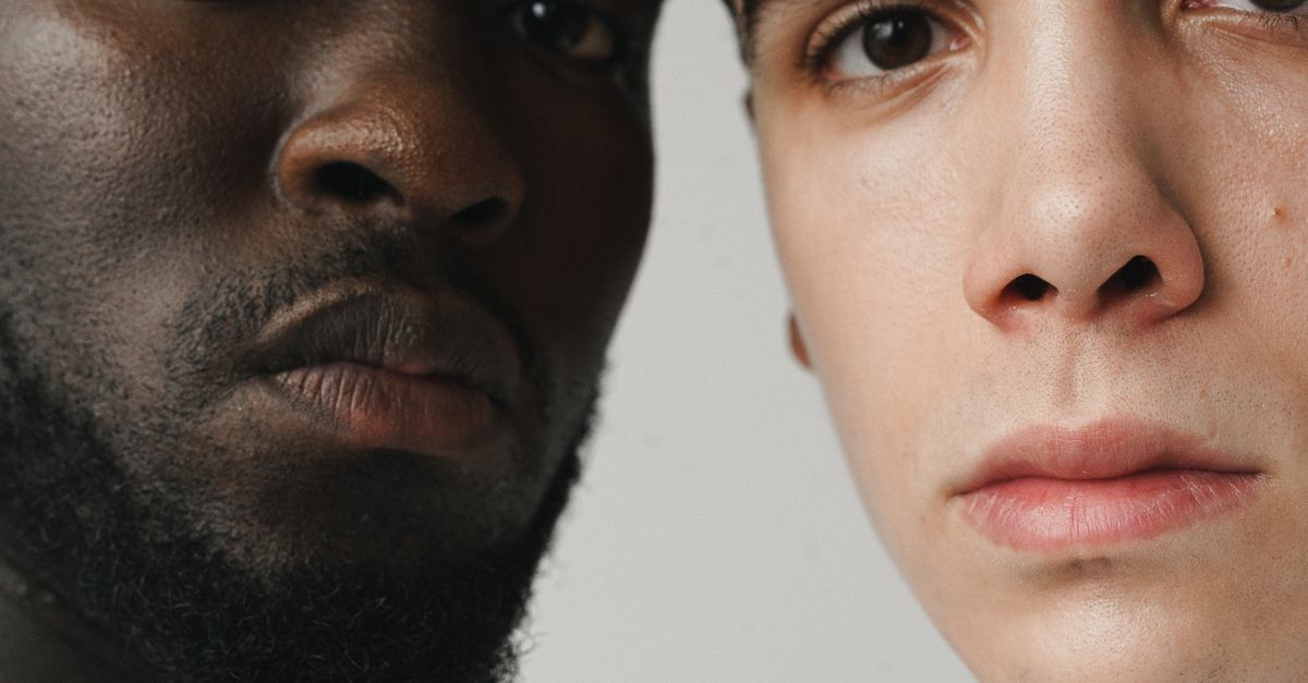 A side-by-side comparison of a real human face and a deepfake face showing the tell-tale warping around the glasses and hairline