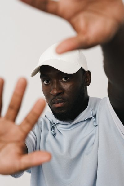 Portrait of a young man in a cap, photo by SHVETS production on Pexels